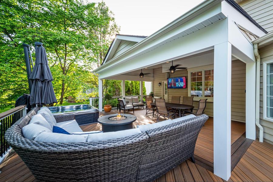 Custom deck built around a Virginia home with integrated seating and outdoor features